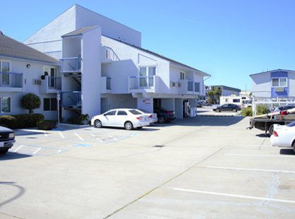 Welcome To The SAND DOLLAR INN - Exterior View Of Hotel 